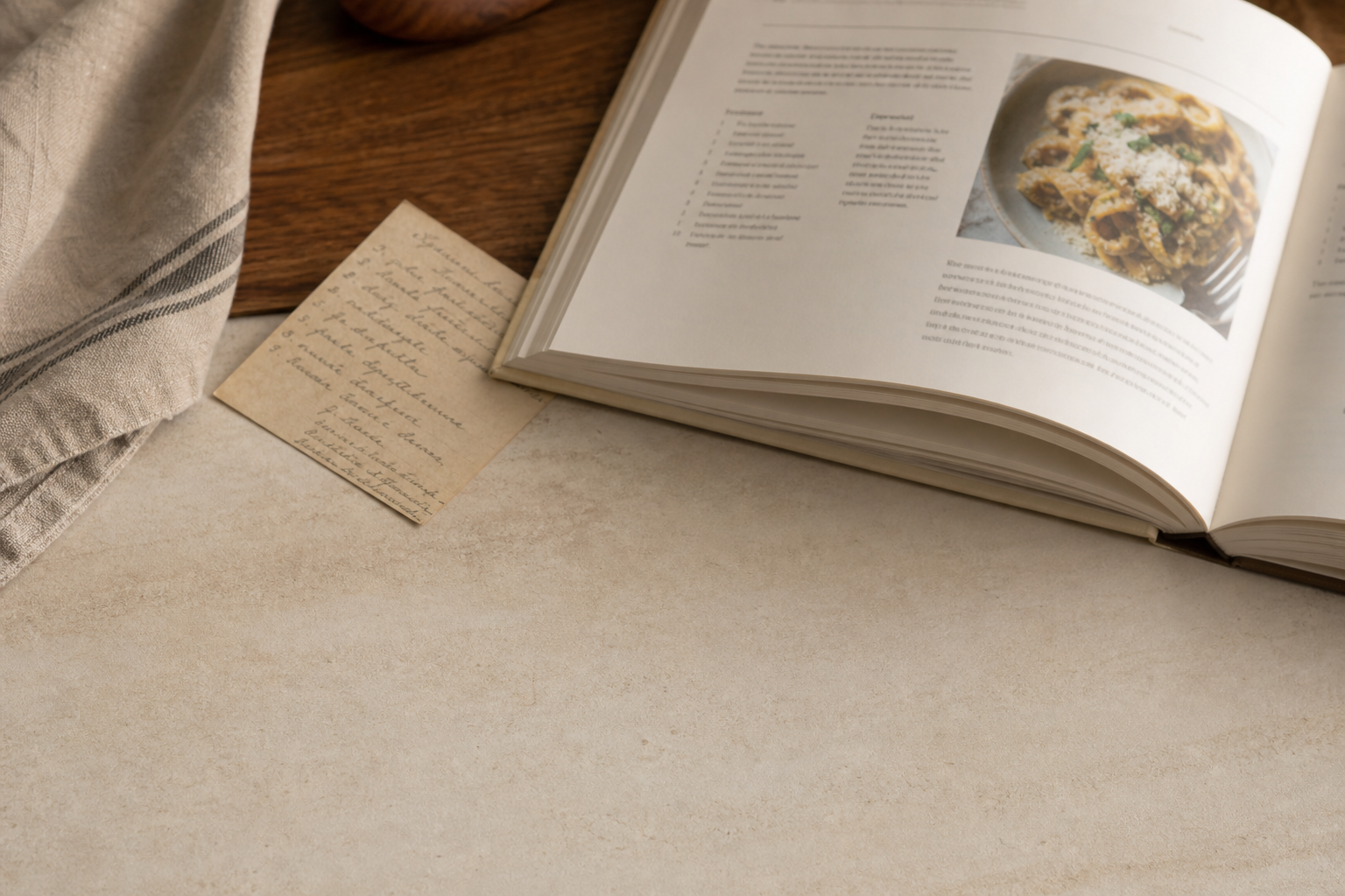 Open cookbook and handwritten recipe note used as source material